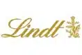 Lindt logo in gold cursive lettering with a decorative emblem on the right side on a white background.